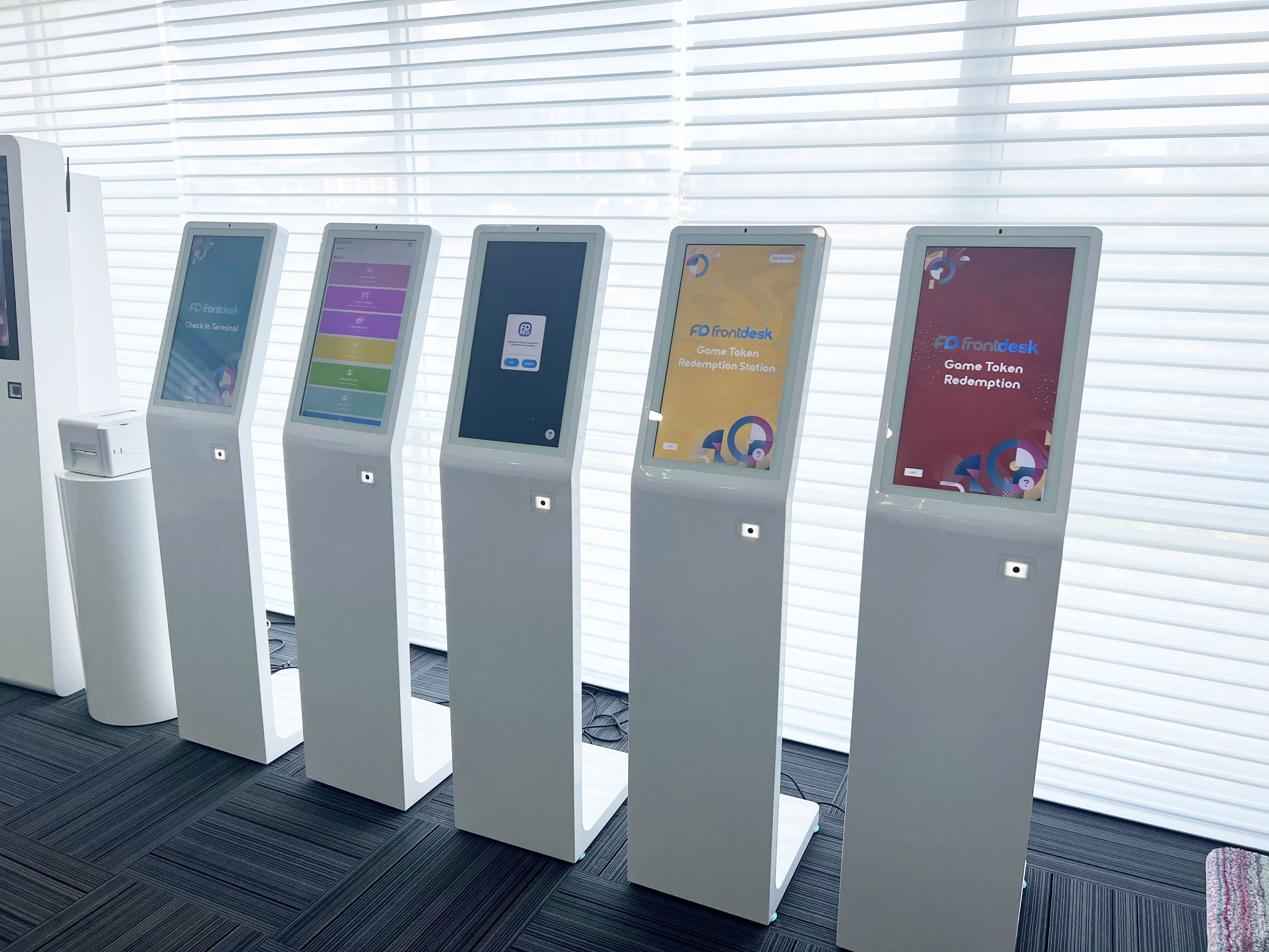 The image showcases our interactive kiosk equipped with a web application, built-in camera, and QR scanner. This cutting-edge kiosk enables seamless interaction between users and the digital environment.